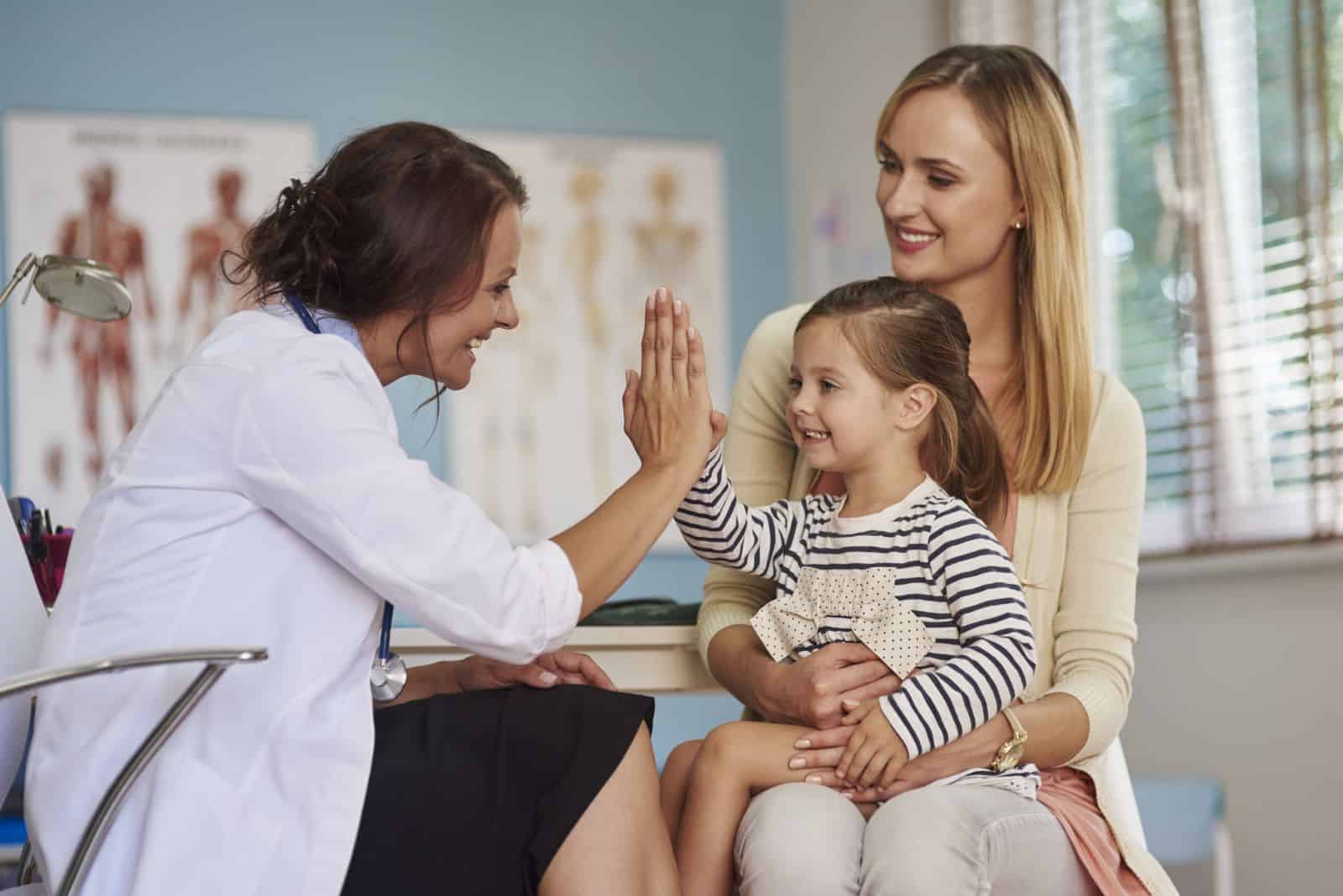 Integrative functional medicine doctor and her young patient