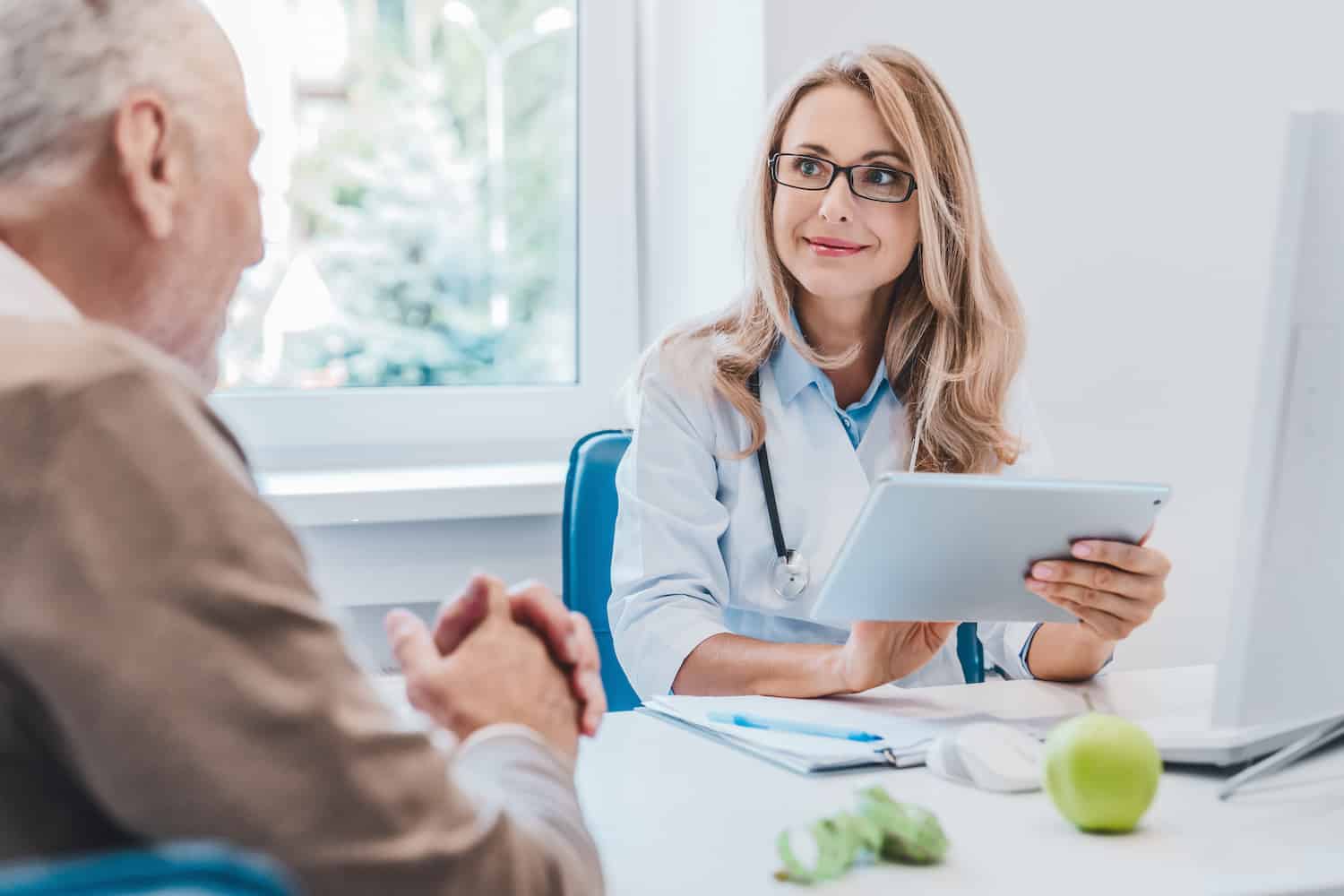 personalized medicine: doctor talking to an elderly patient