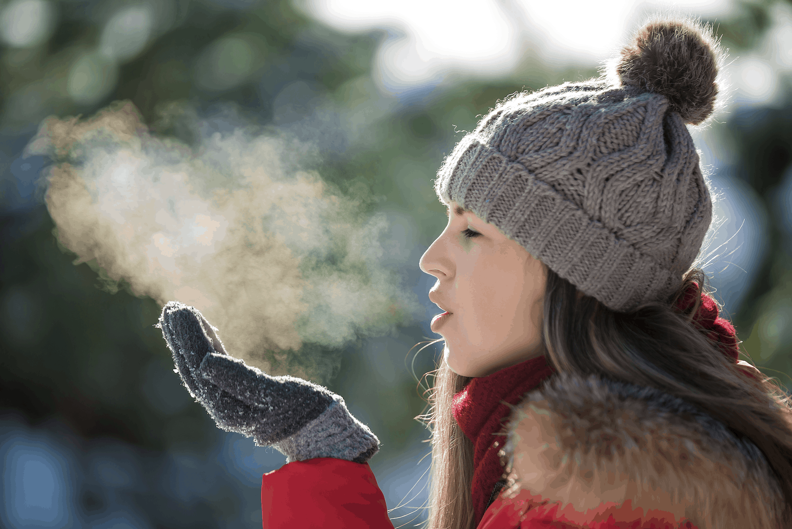 SIBO breath test: Woman breathing out air during winter